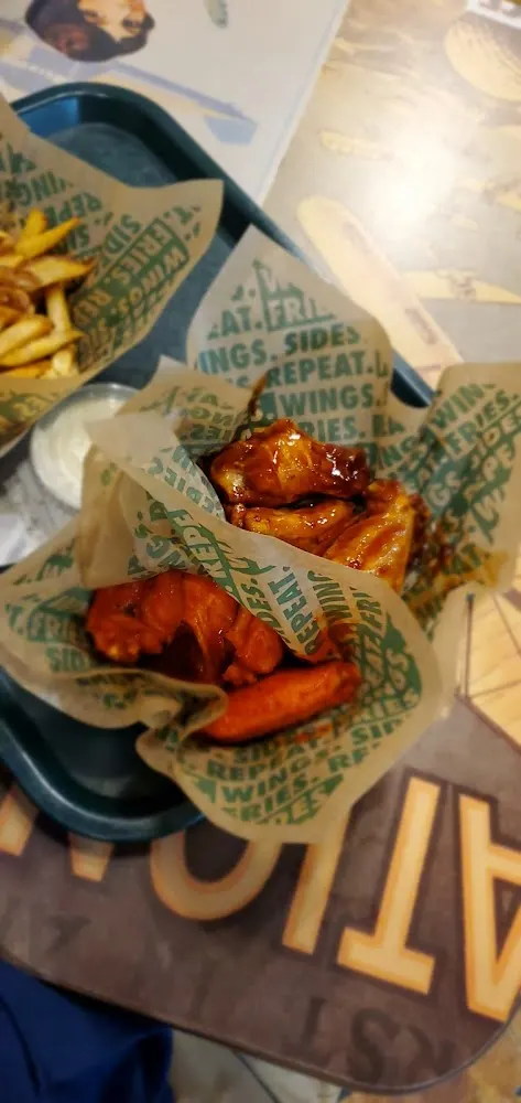 Wingstop food and storefront view at 7049 San Pedro Ave in San Antonio, Texas