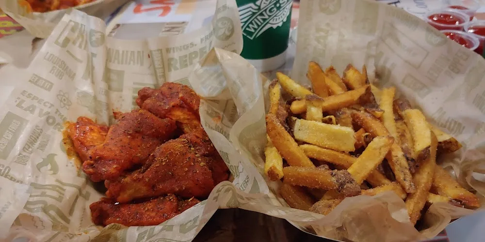 Wingstop food and storefront view at 6424 NW Loop 410 Ste 103 in San Antonio, Texas