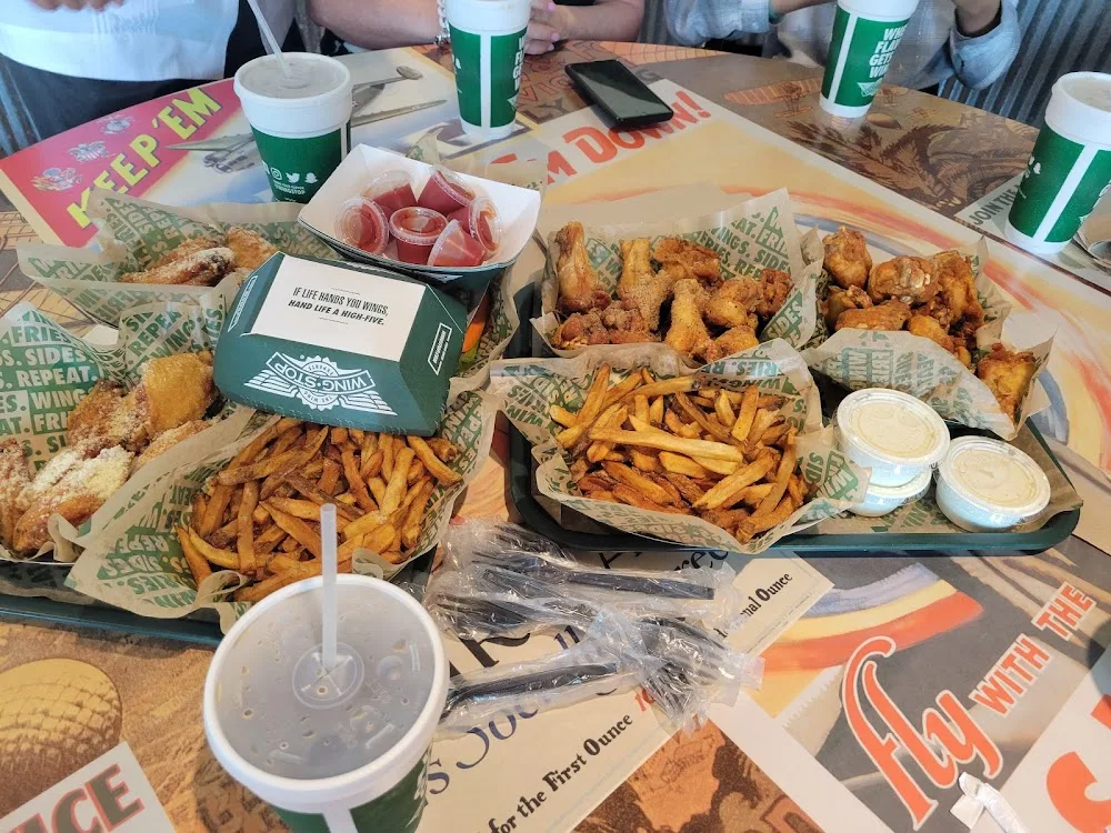 Wingstop food and storefront view at 21134 U.S. 281 #101 in San Antonio, Texas