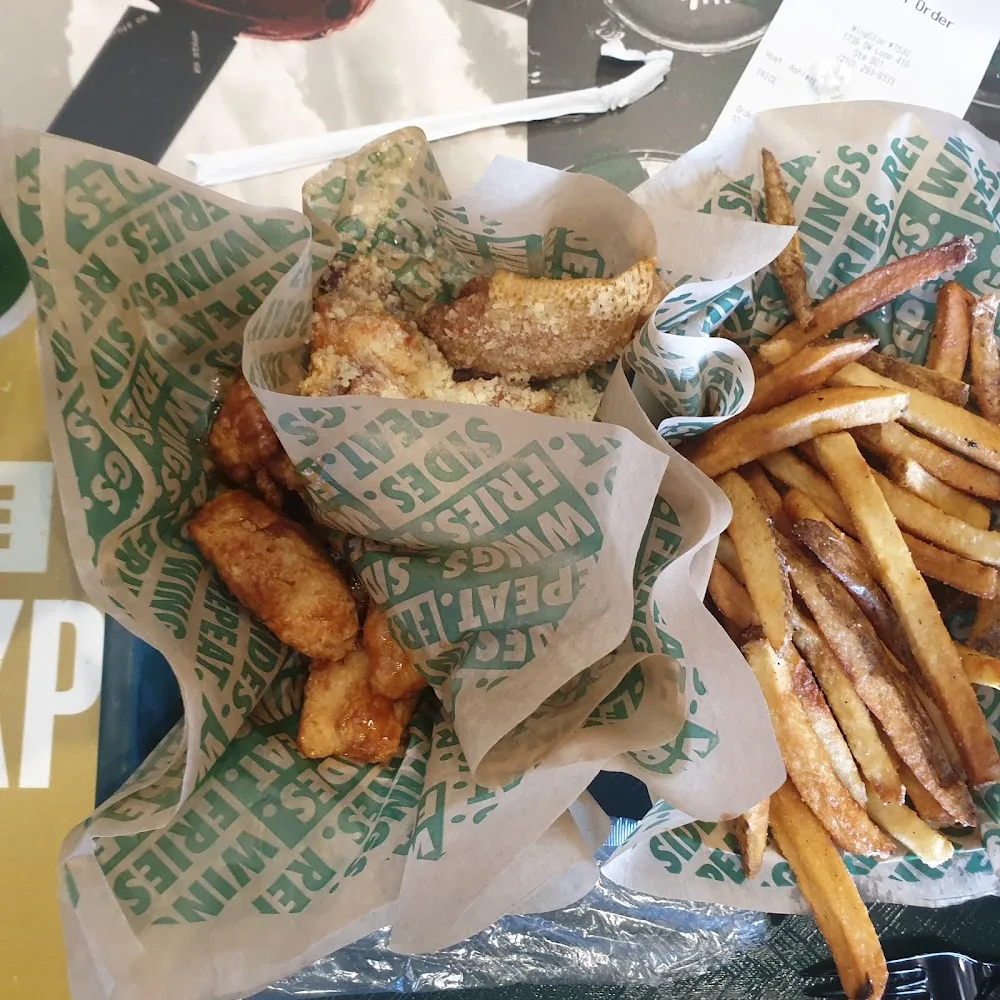 Wingstop food and storefront view at 1739 SW Loop 410 Ste 501 in San Antonio, Texas