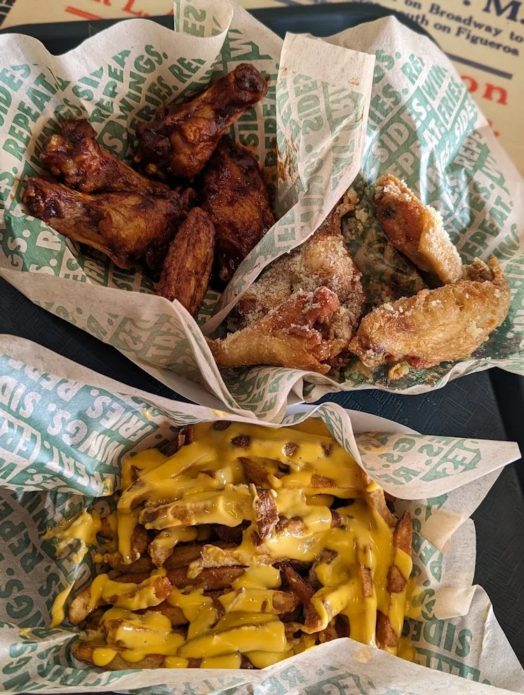 Wingstop food and storefront view at 13909 Nacogdoches Rd Ste 104 in San Antonio, Texas
