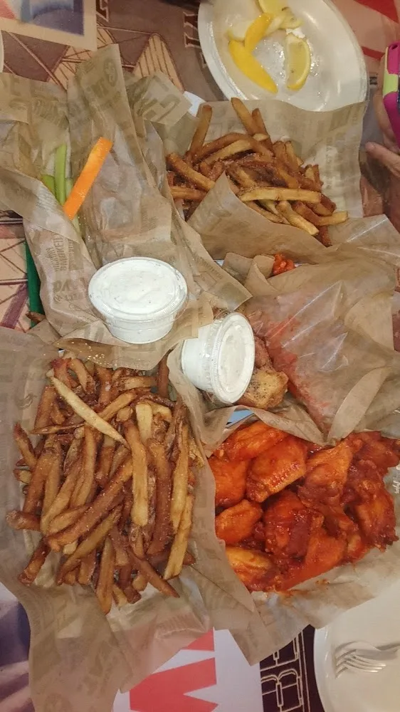 Wingstop food and storefront view at 1141 US-77 Business in San Benito, Texas