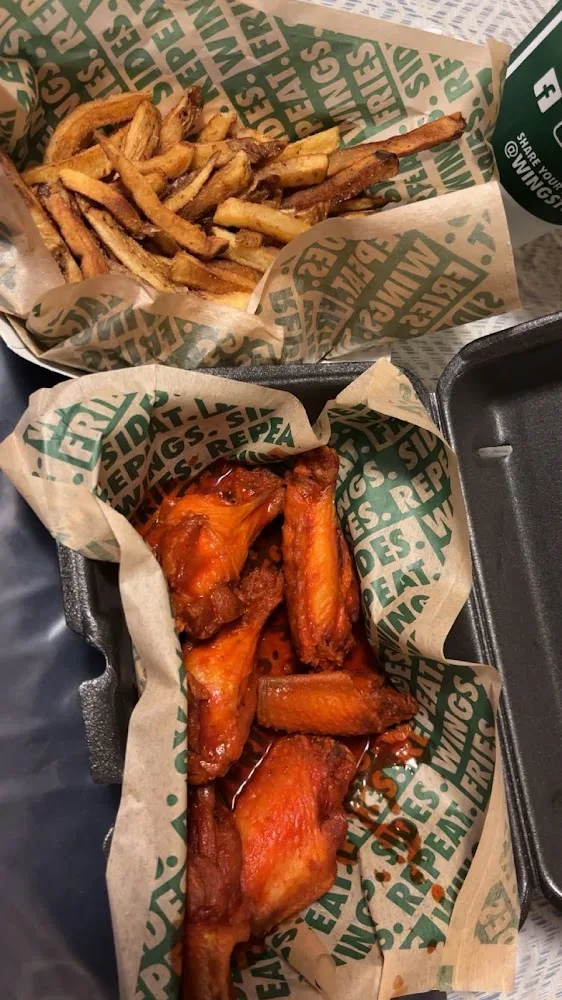 Wingstop food and storefront view at 826 W. US Highway 83 in San Juan, Texas