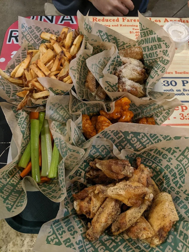 Wingstop food and storefront view at 4001 N US Highway 75 in Sherman, Texas
