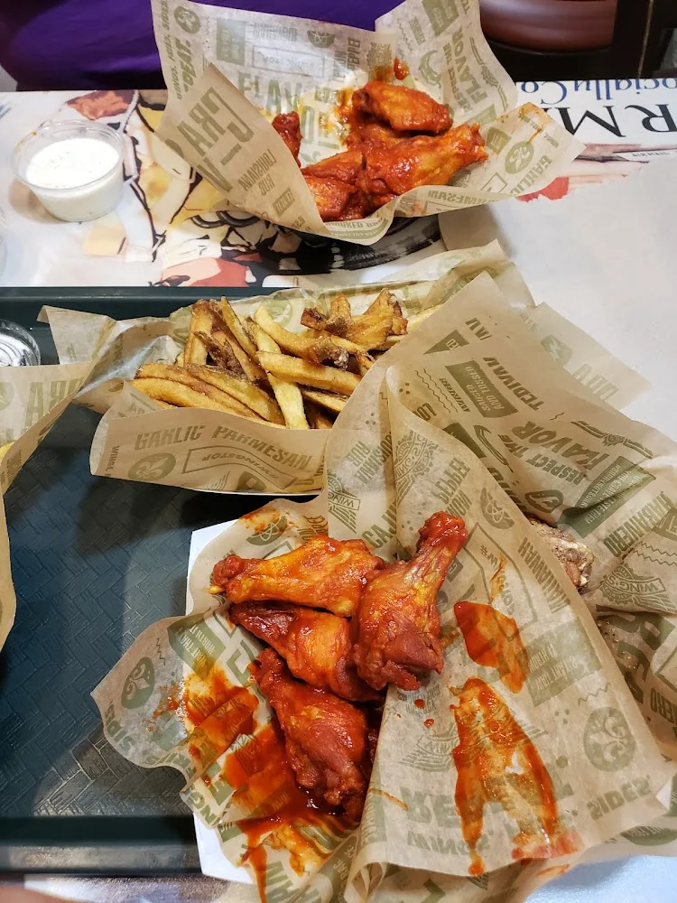 Wingstop food and storefront view at 16525 Lexington Blvd Ste 120 in Sugar Land, Texas