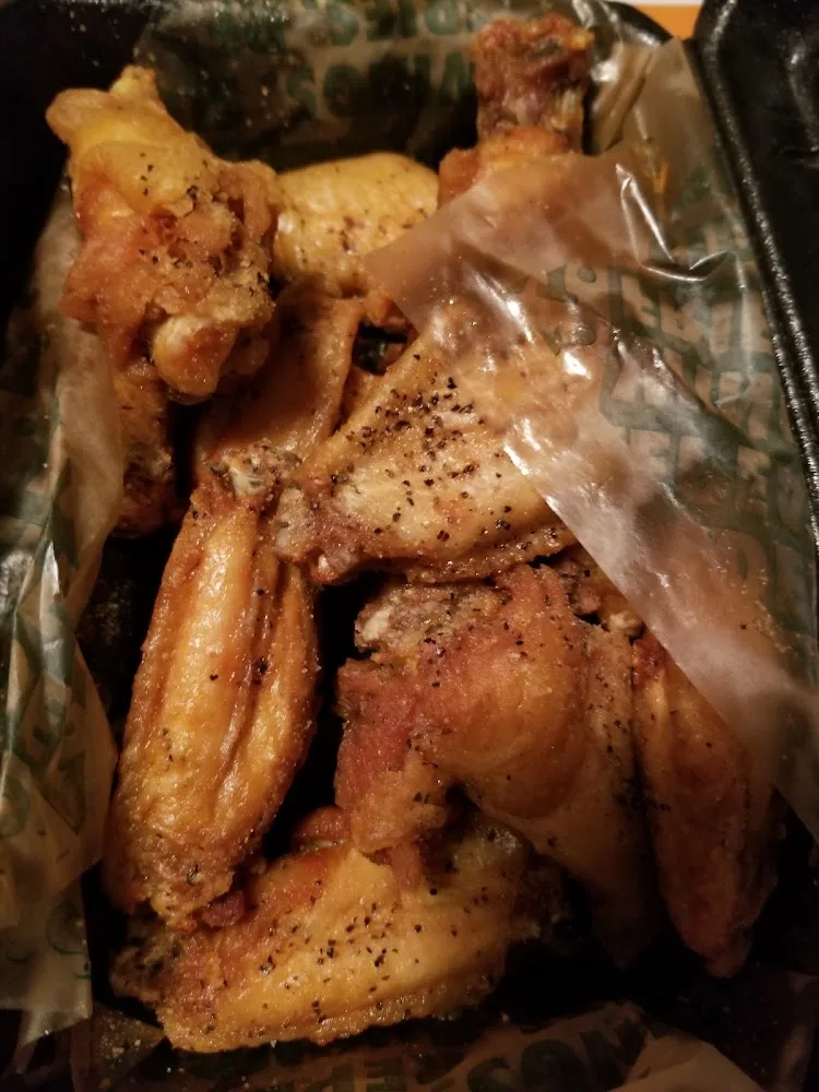 Wingstop food and storefront view at 3024 S 31St St in Temple, Texas