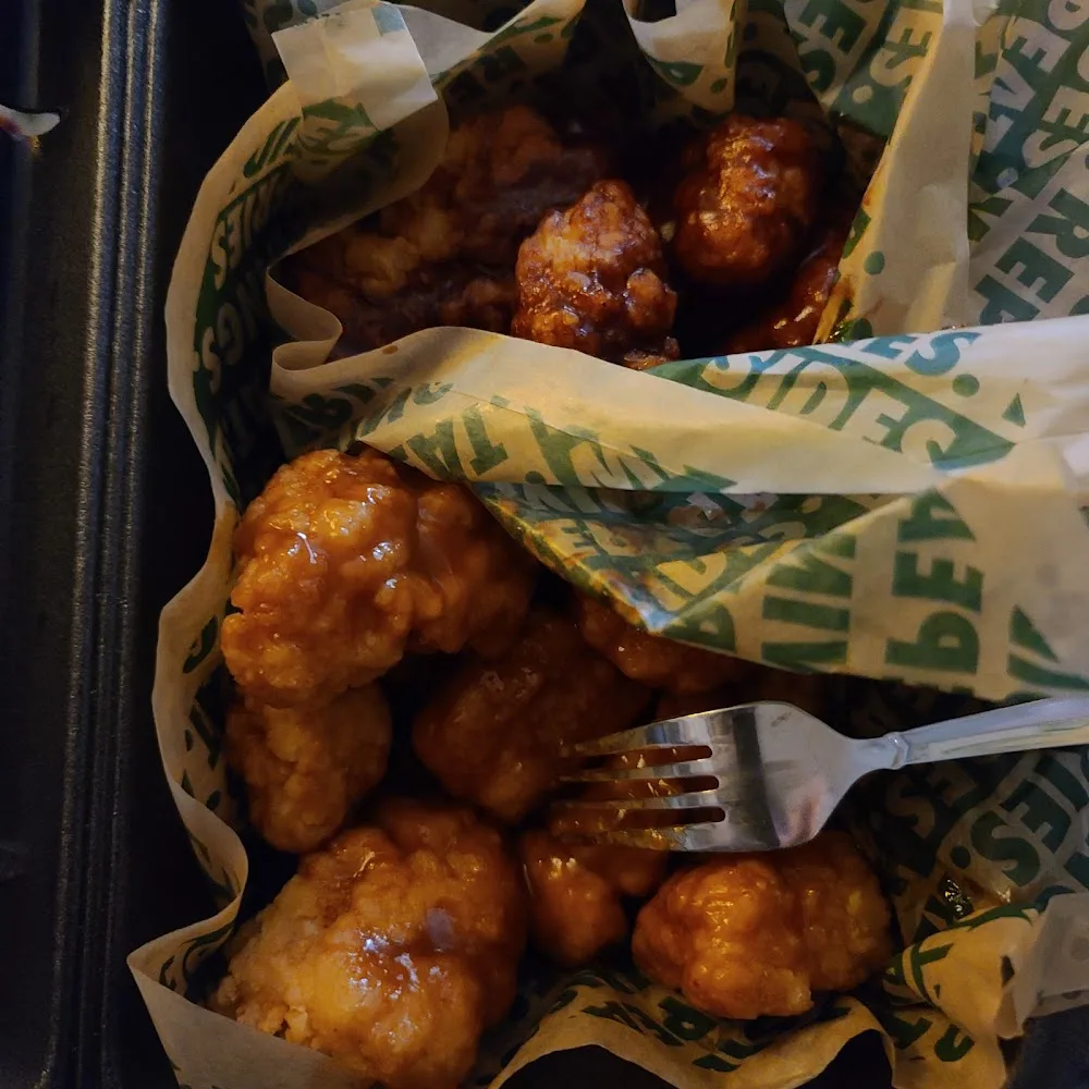 Wingstop food and storefront view at 4709 State Hwy 121 in The Colony, Texas