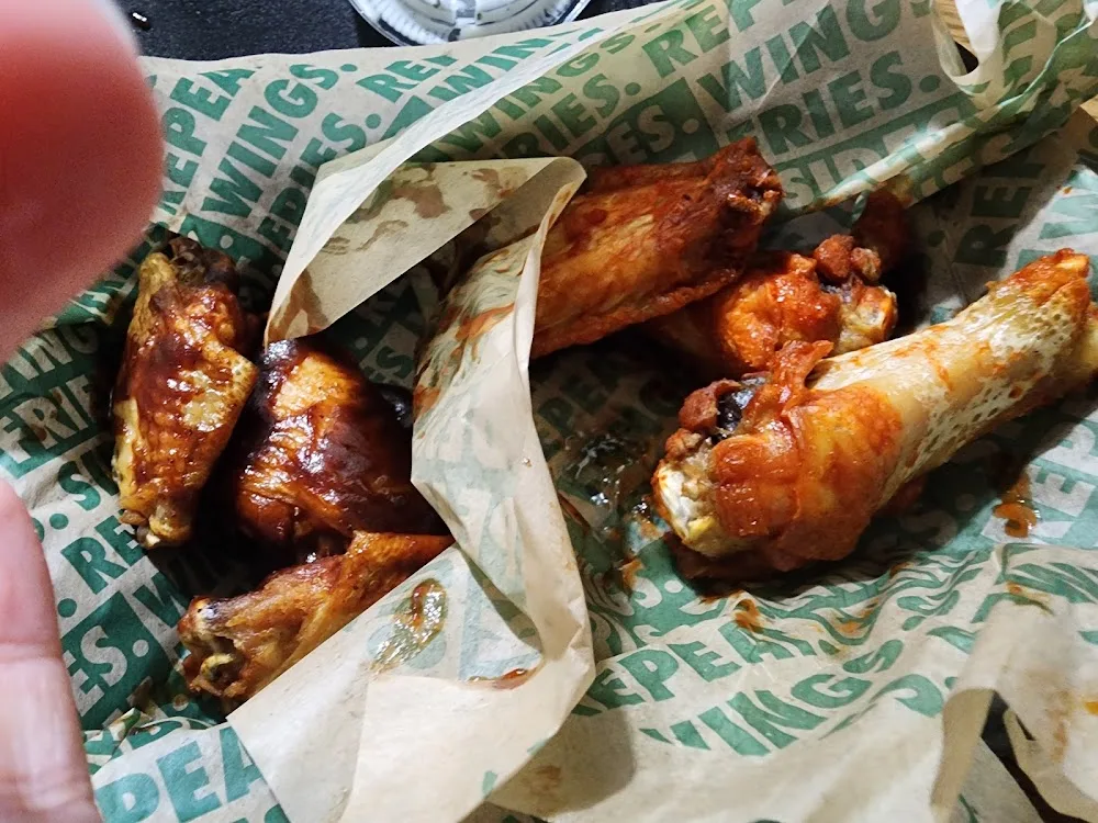 Wingstop food and storefront view at 2210 TX-114 in Trophy Club, Texas