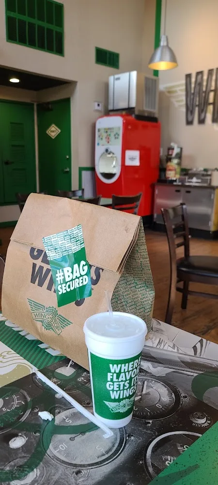Wingstop food and storefront view at 220 S 2Nd St Ste 2 in Waco, Texas