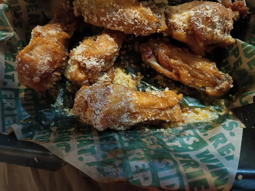 Wingstop food and storefront view at 220 S 2Nd St Ste 2 in Waco, Texas