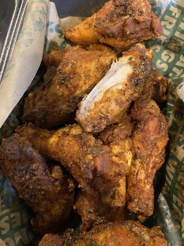Wingstop food and storefront view at 1201 Hewitt Dr Ste 211A in Waco, Texas