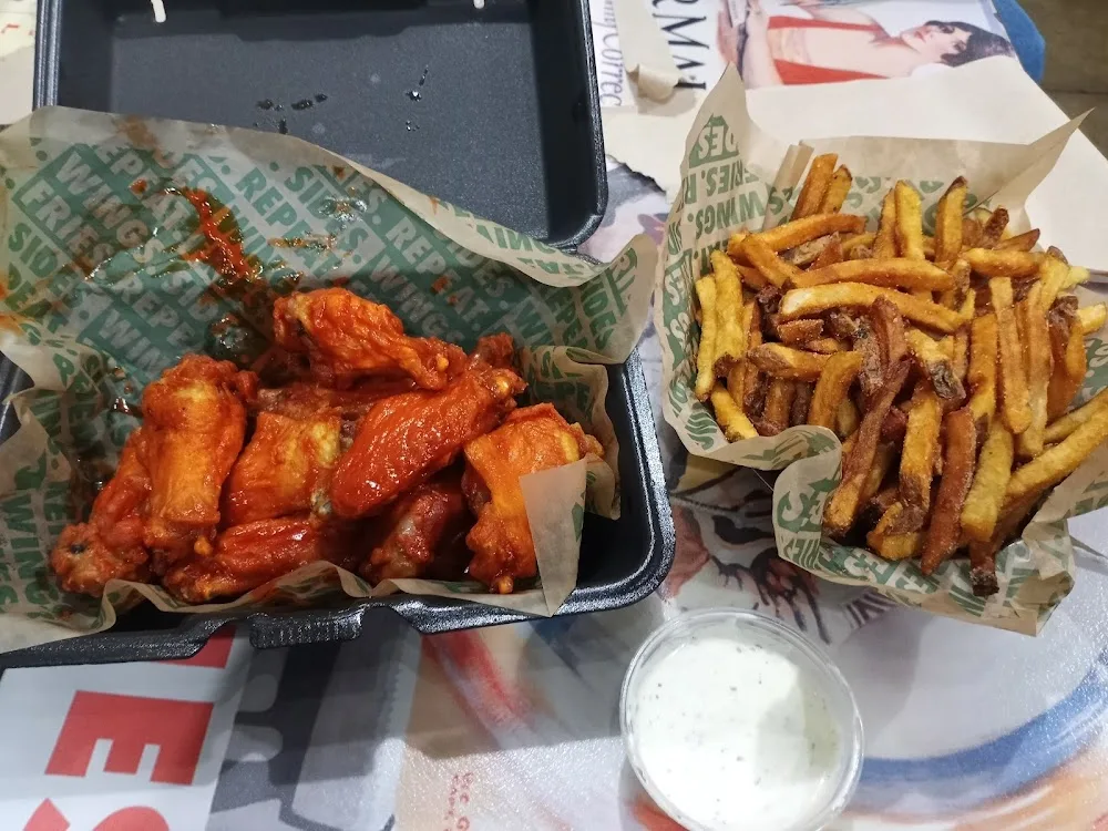 Wingstop food and storefront view at 8436 Denton Hwy Ste 203 in Watauga, Texas