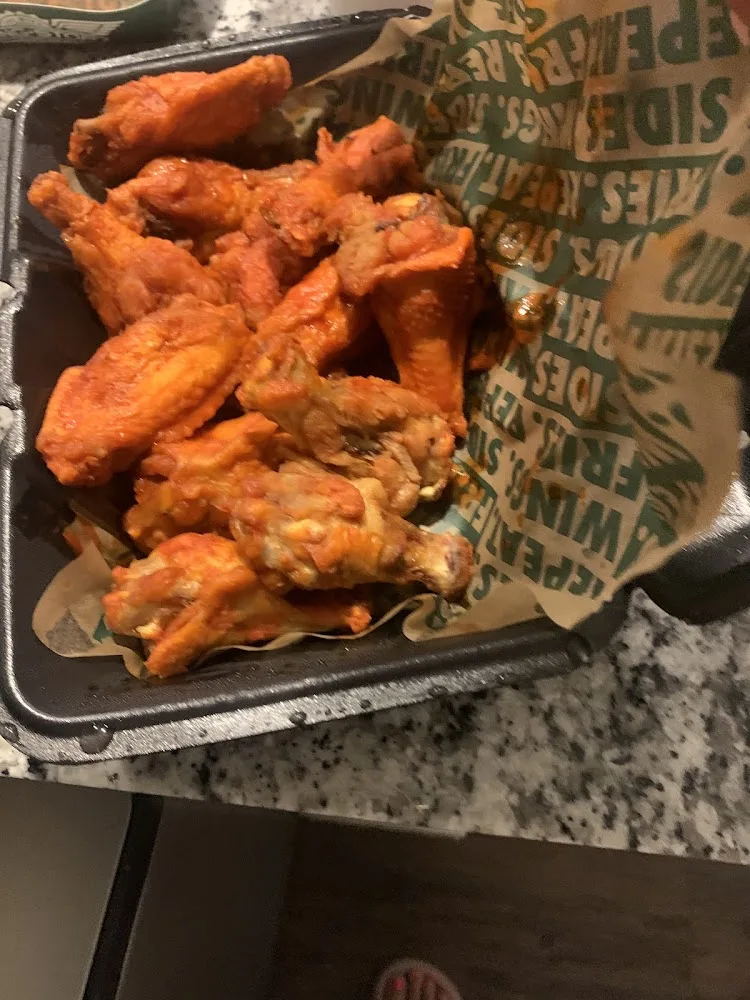 Wingstop food and storefront view at 1440 N Highway 77 Ste 13 in Waxahachie, Texas