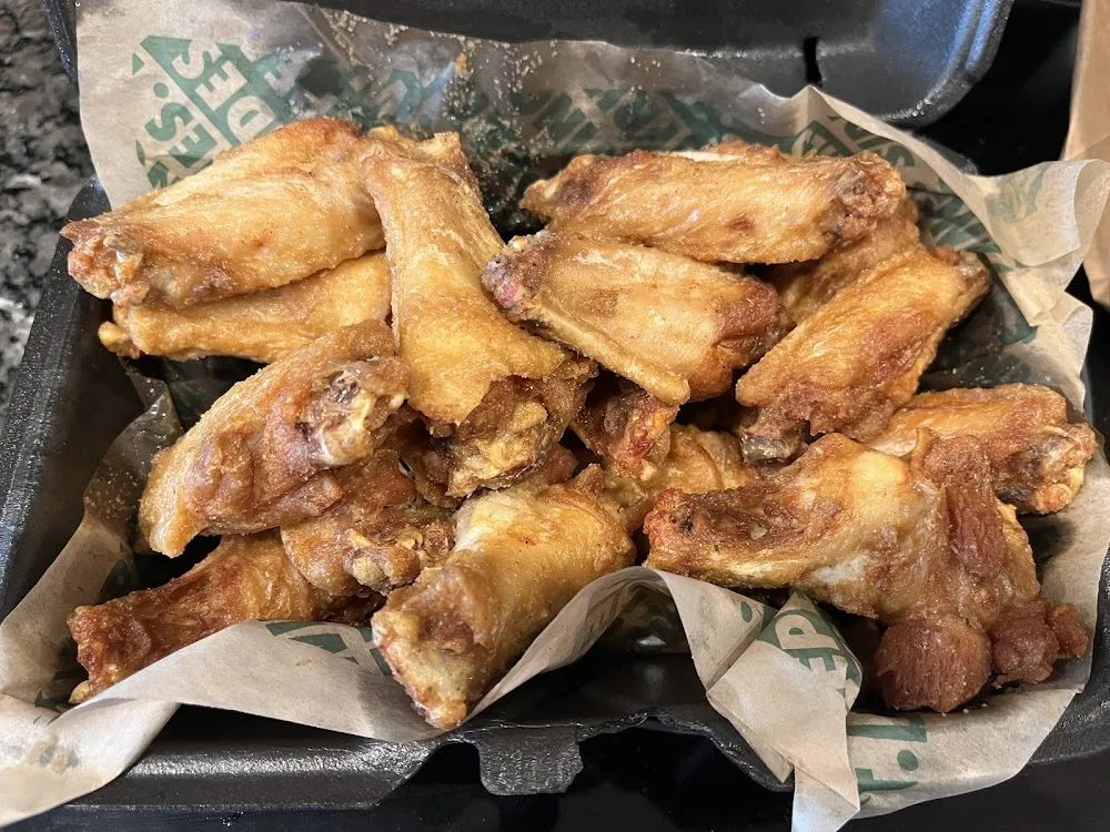 Wingstop food and storefront view at 602 Donald Preston Dr. Suite 105 & 106 in Wolfforth, Texas