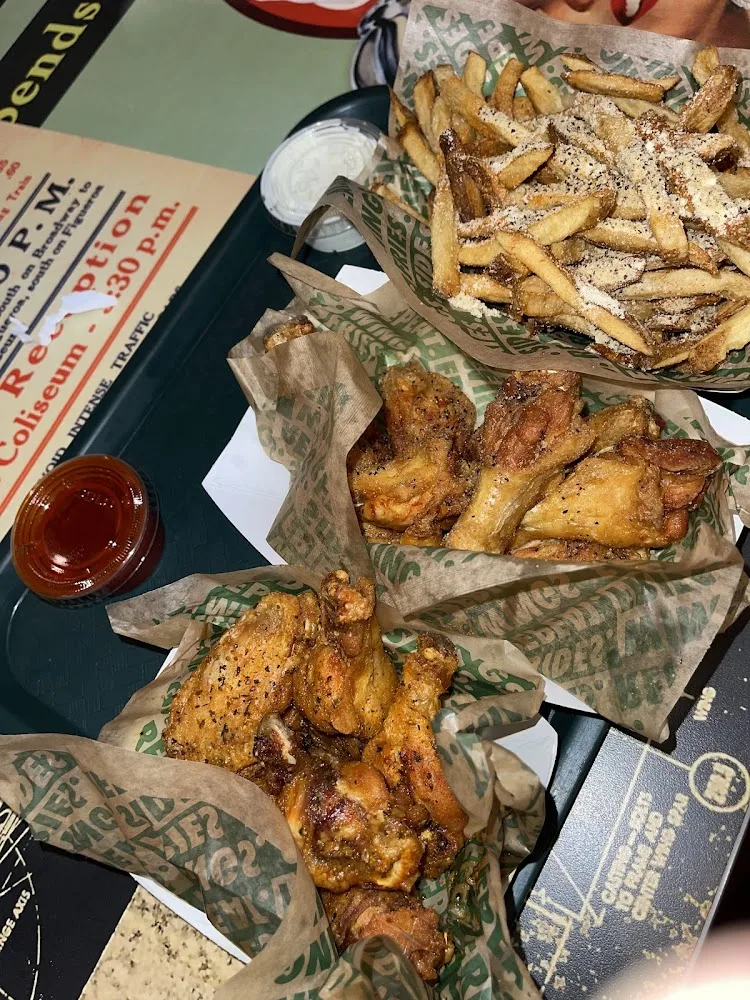 Wingstop food and storefront view at 12717 Interstate 45 North in Willis, Texas