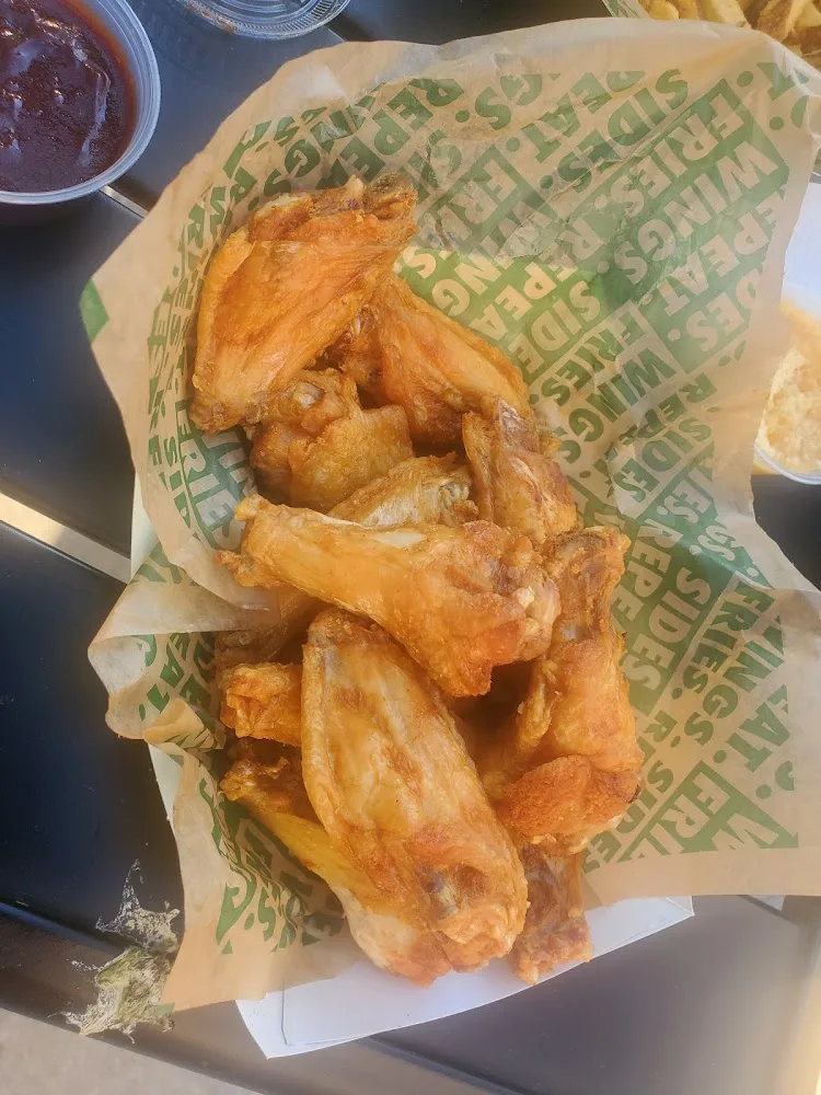 Wingstop food and storefront view at 2885 S. 5600 West Suite A in West Valley, Utah