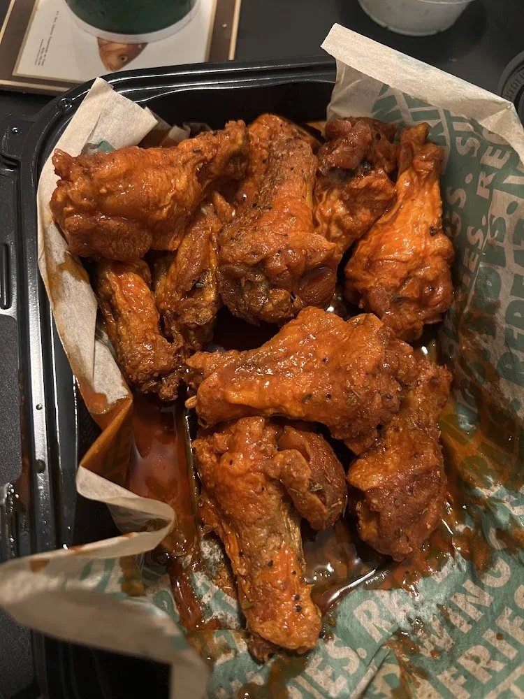 Wingstop food and storefront view at 4010 Wards Rd Ste B in Lynchburg, Virginia