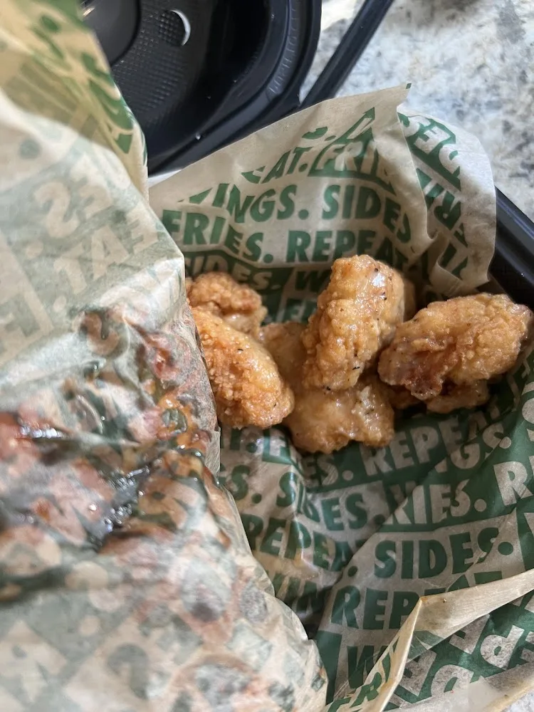 Wingstop food and storefront view at 100 Triangle Shopping Center in Longview, Washington