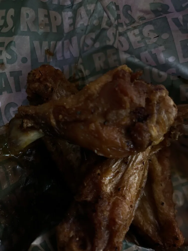 Wingstop food and storefront view at 10002 Aurora Ave N. Ste 42 in Seattle, Washington