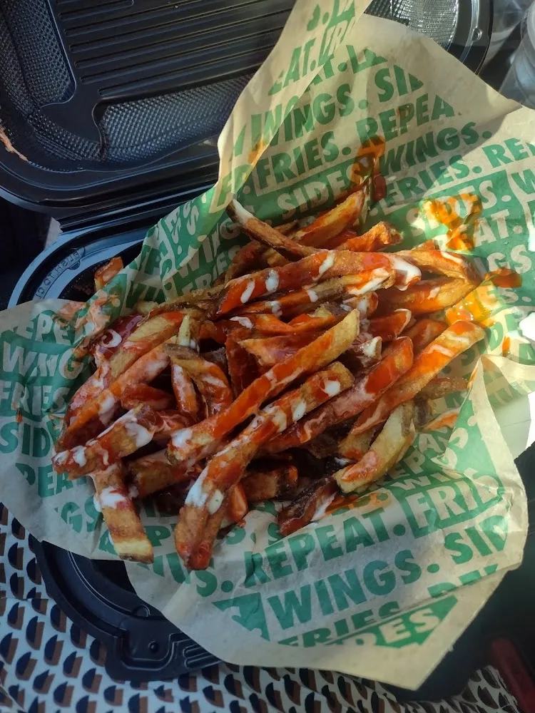 Wingstop food and storefront view at 9926 W. US Route 2 in Spokane, Washington