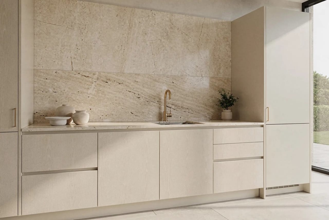 No. III — a pale travertine kitchen in soft daylight.