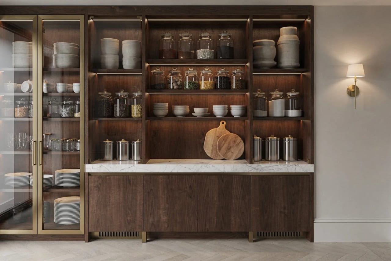 A glazed larder dresser stocked with crockery and jars.