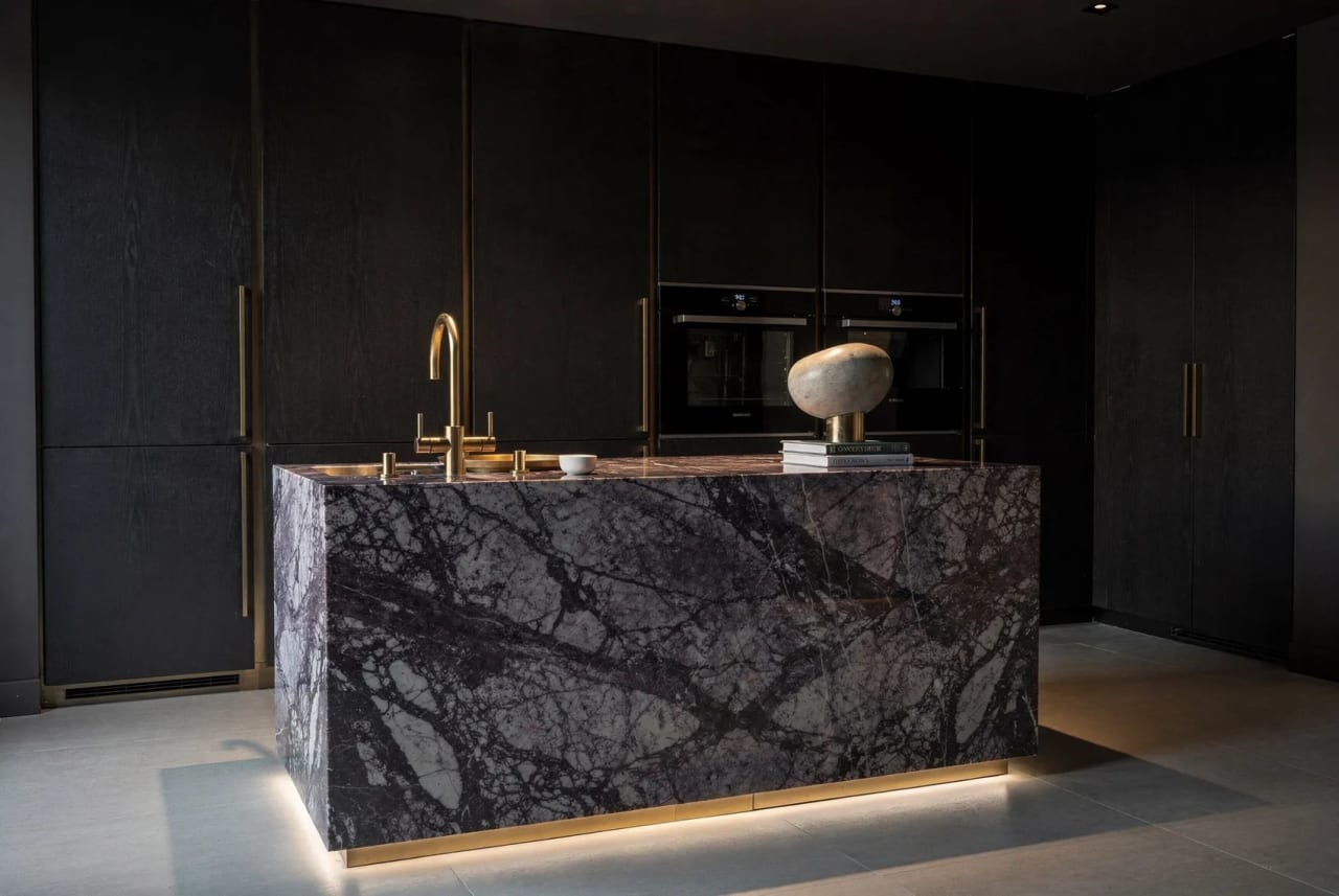 No. V — a dark, dramatic kitchen with a Viola-marble island.