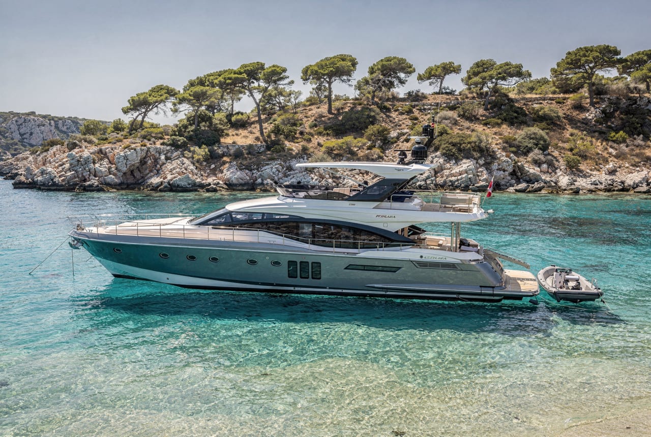 M/Y Sirocco — a 48-metre yacht at anchor in a turquoise bay.