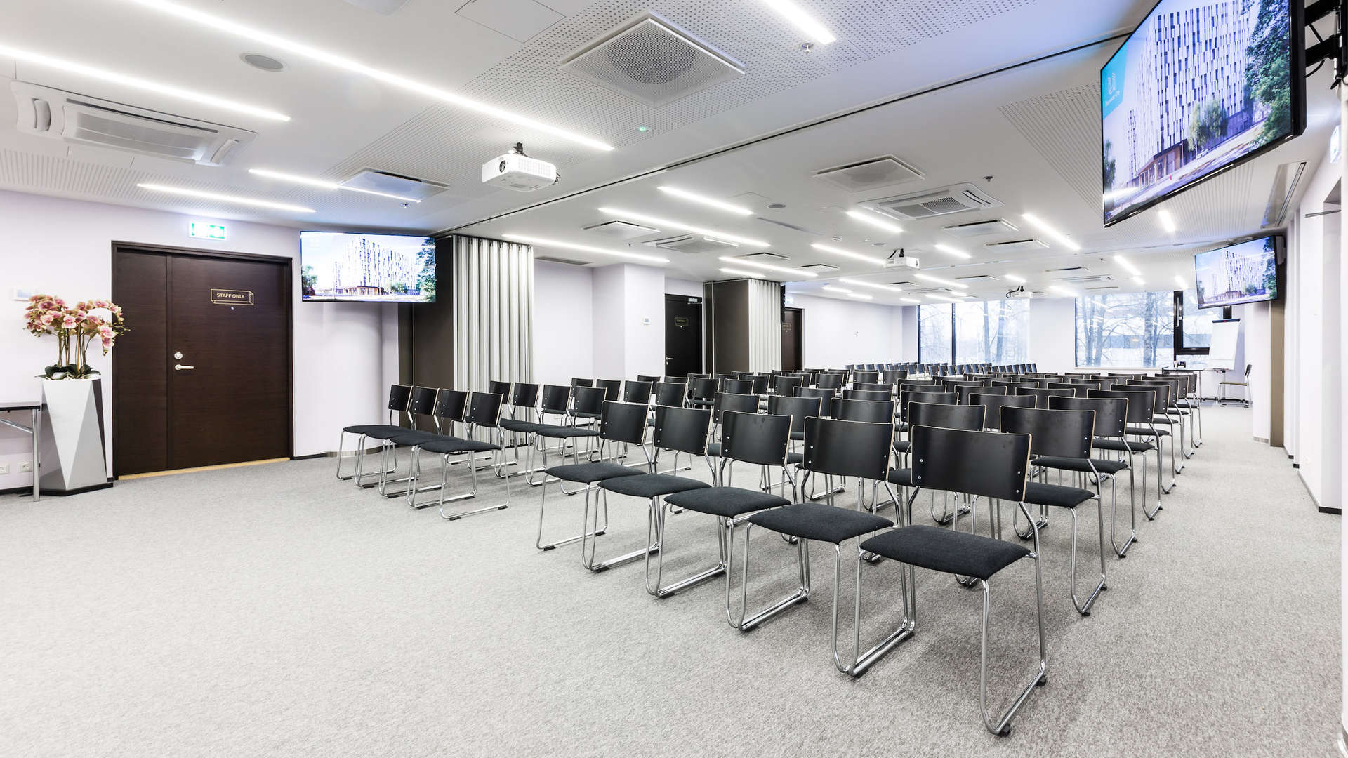 Seminar room for 160 persons on the 2nd floor of newly built Öpiku building in Ülemiste campus. The room is bright and well-equipped: projector and 236" projector screen, 6x120W wall-mounted speakers, Barco ClickShare system, 4x55 "LCD screens for displaying the prepared advertising info (images, videos), free WIFI, white board and markers, paper and pencils.