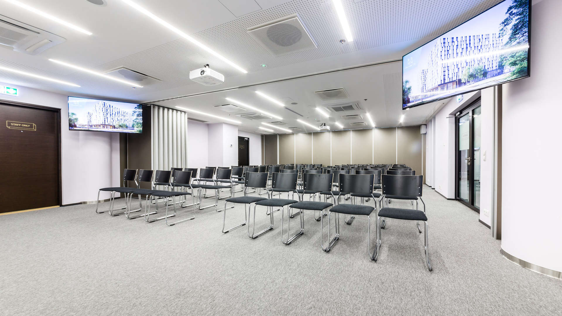 Meeting room for 40 persons on the 2nd floor of newly built Öpiku building in Ülemiste campus. The room is well-equipped: projector and 130" projector screen, 2x120W wall-mounted speakers, 2x55 "LCD screens for displaying the prepared advertising info (images, videos), free WIFI, white  board and markers, paper and pencils.