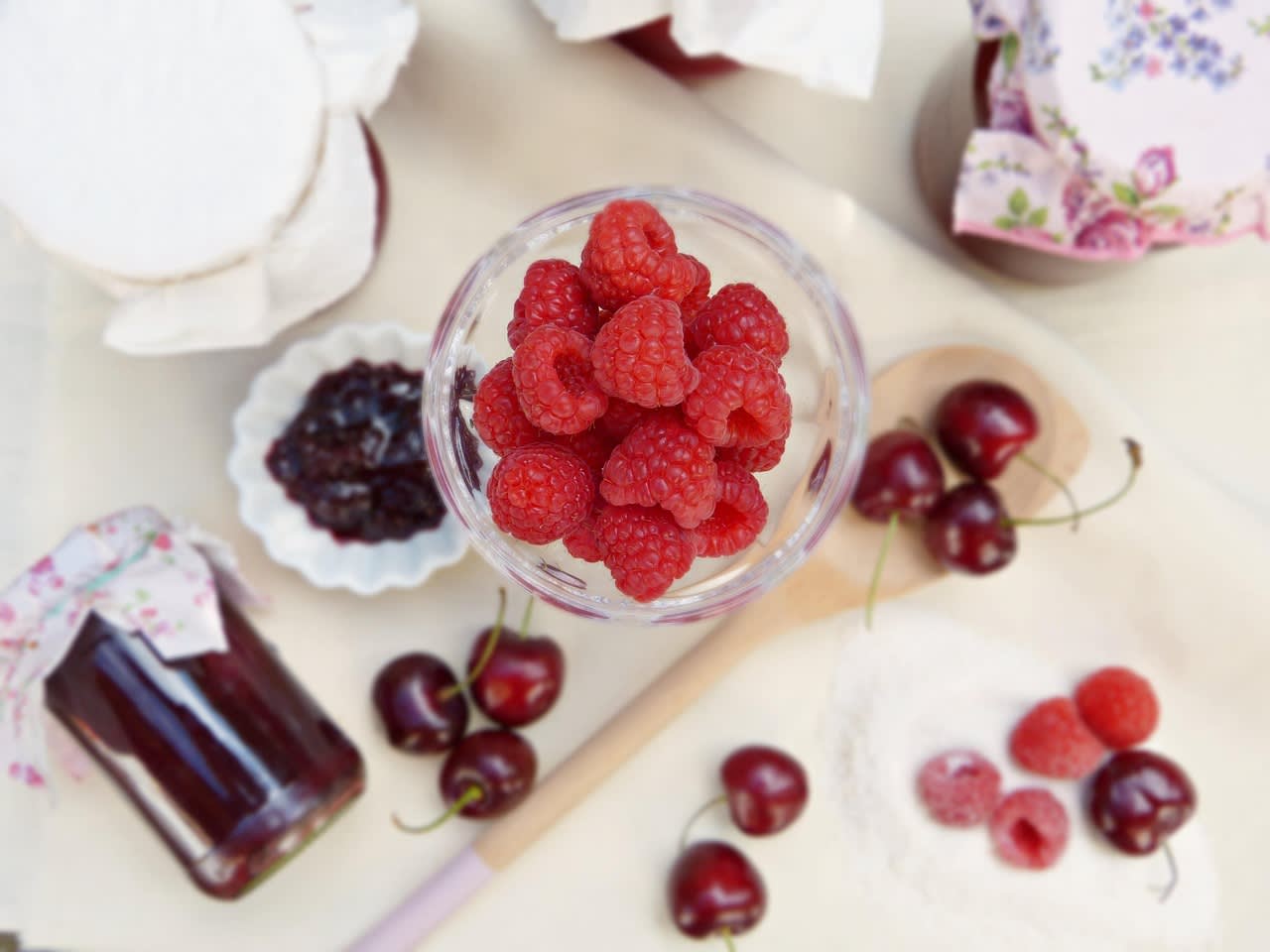 raspberries, jam, boil down, cherries, glasses, wooden spoon, homemade, gift, sugar, preserving sugar, diet, sugar-free, xylitol, stevia, fruit, bread spread, raspberry jam, jam cooking, healthy, potted, jar of jam, cook, vitamins, mason jars, food, pink,