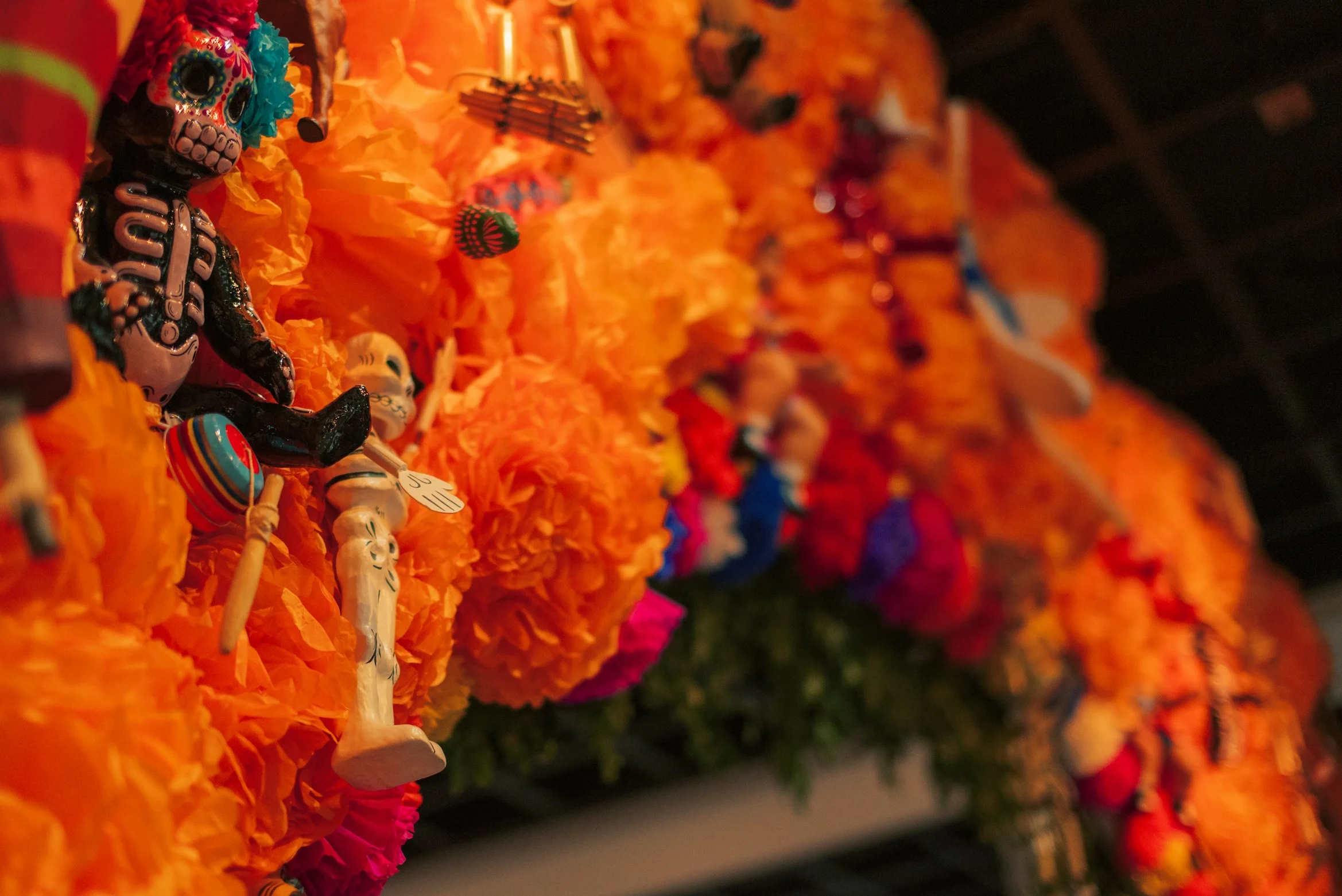 Dia de los muertos installation with flowers and dolls in Ciudad de Mexico