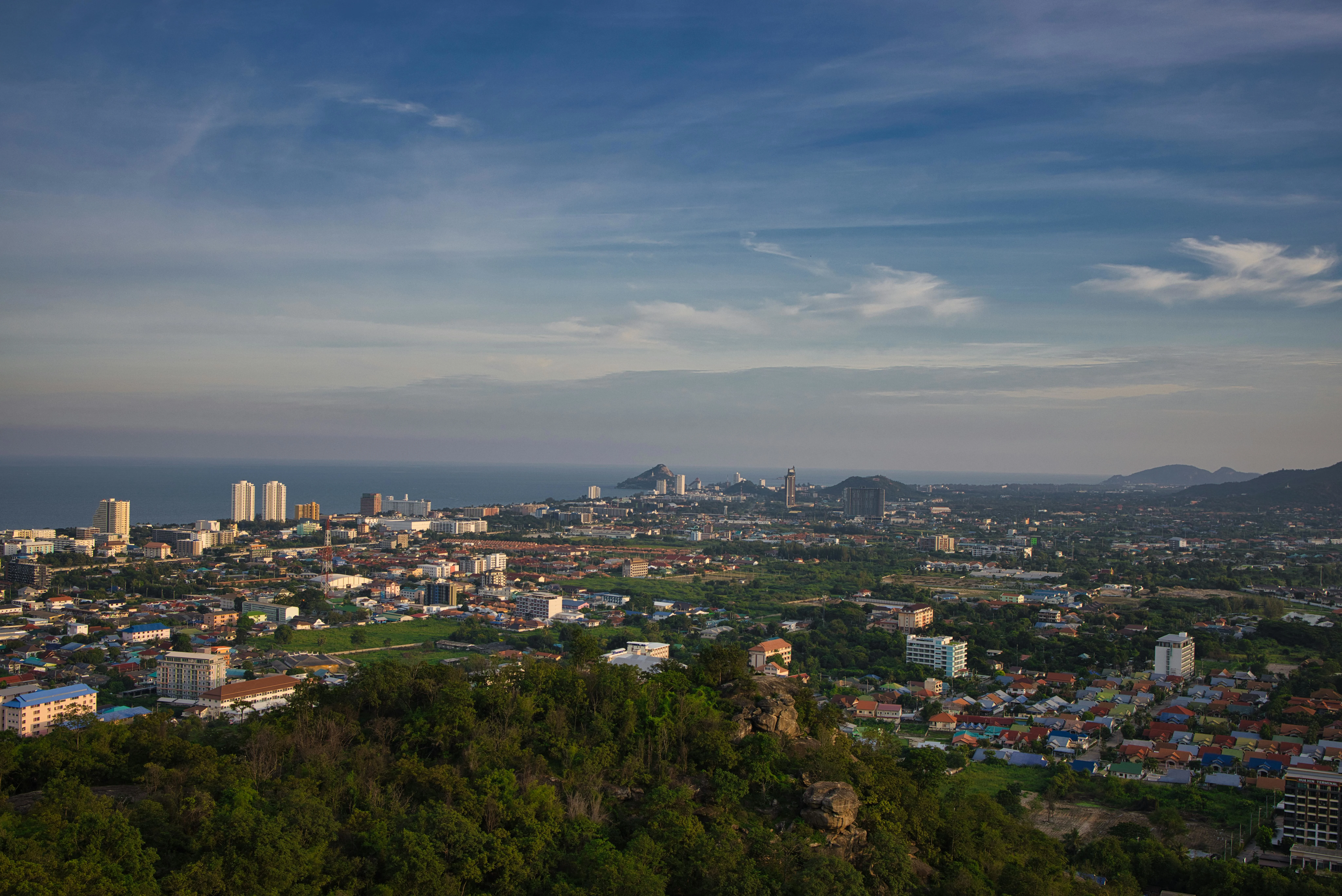 Panoramic aerial view of Hua Hin, Thailand with cityscape and ocean in the distance