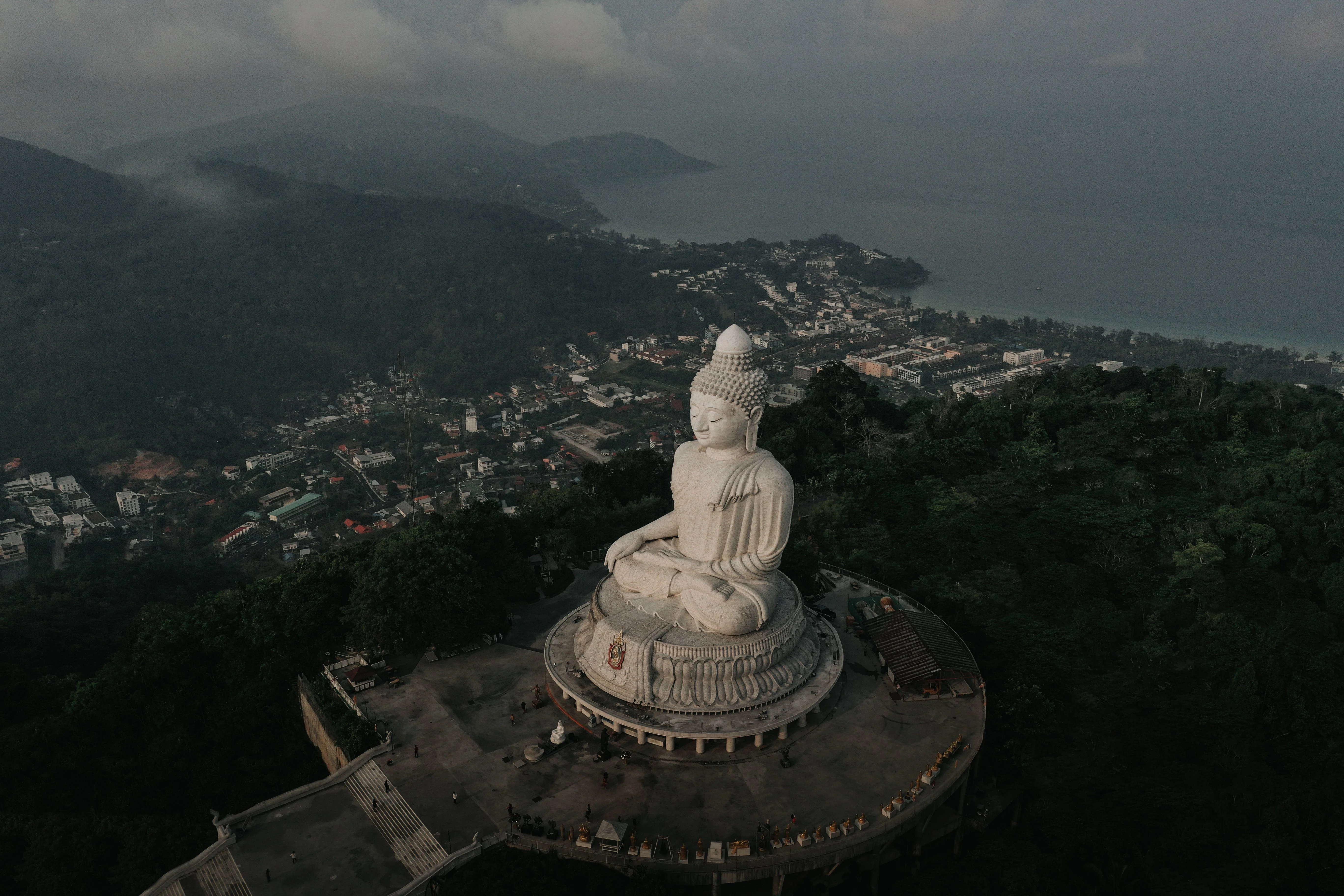 Captivating aerial shot of the iconic Big Buddha statue overlooking Phuket, Thailand's lush landscape