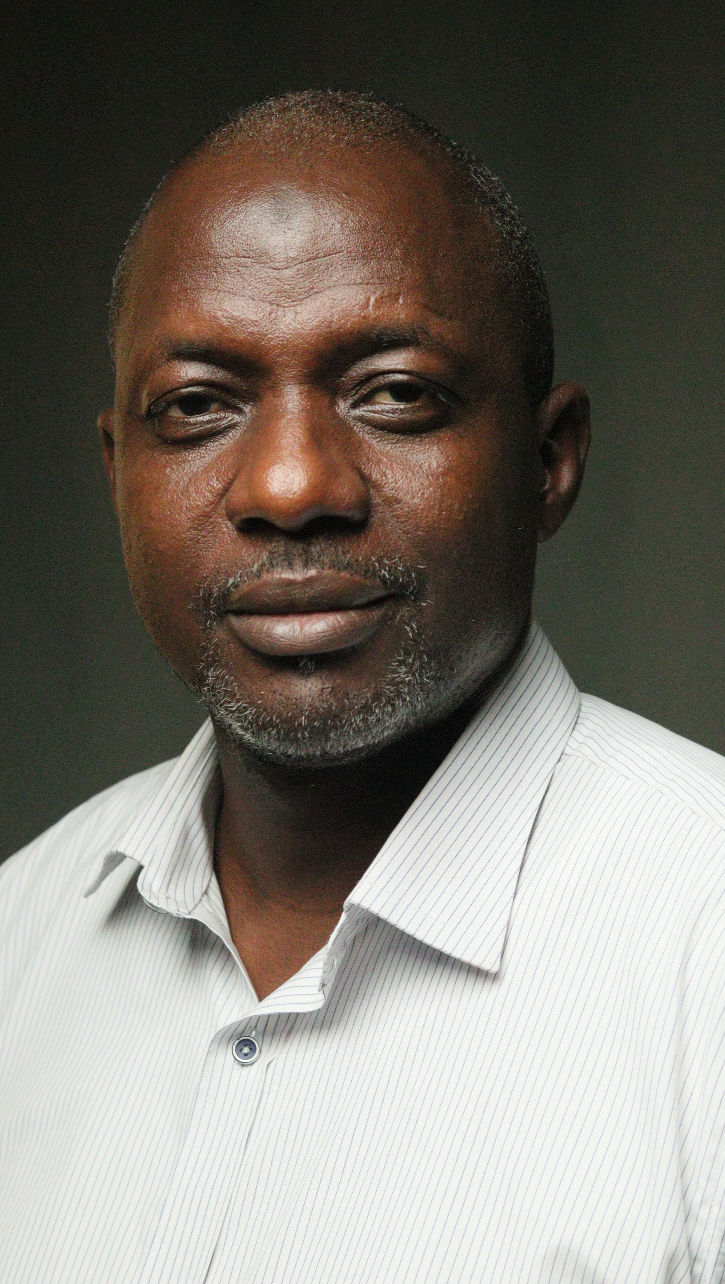 image of akeem toafik, audit director in stransact, wearing a bright colored shirt.