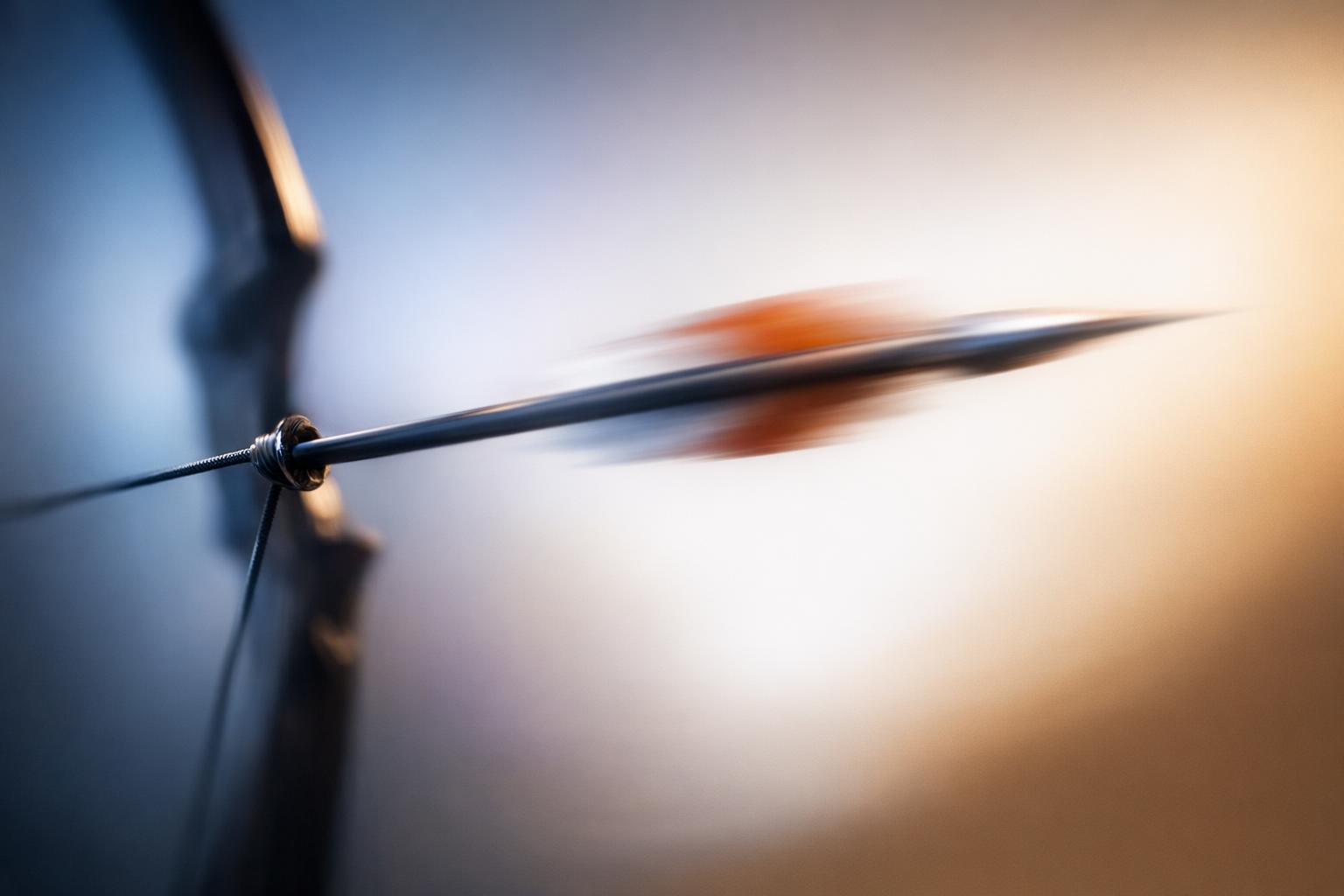 Abstract image depicting a bowstring stretched and releasing an arrow, representing balance between tension and relaxation in effective action.
