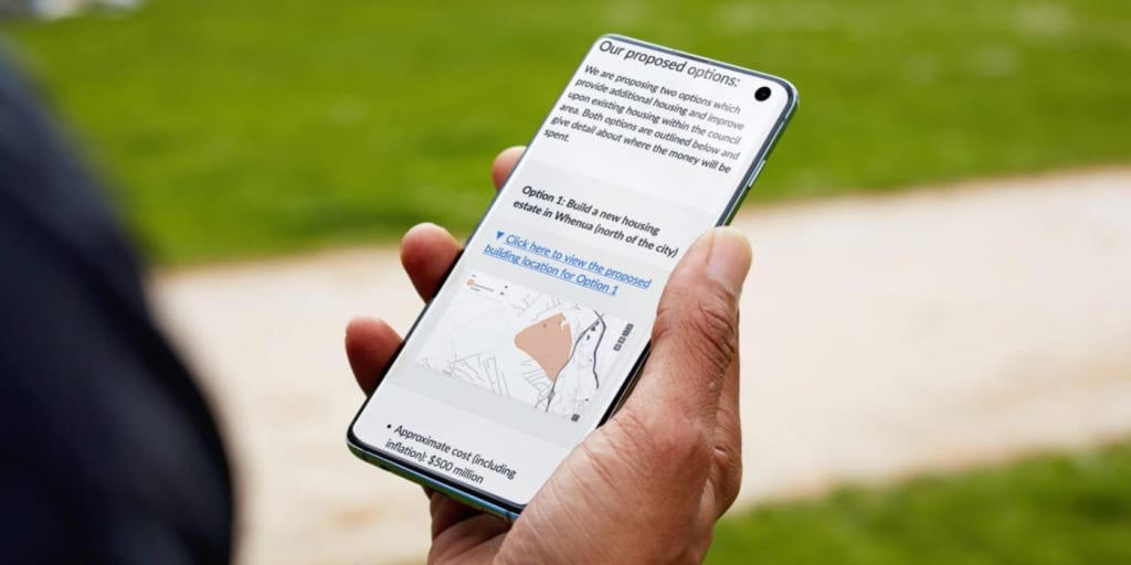 person looking at a phone that displays a statutory consultation on citizen space