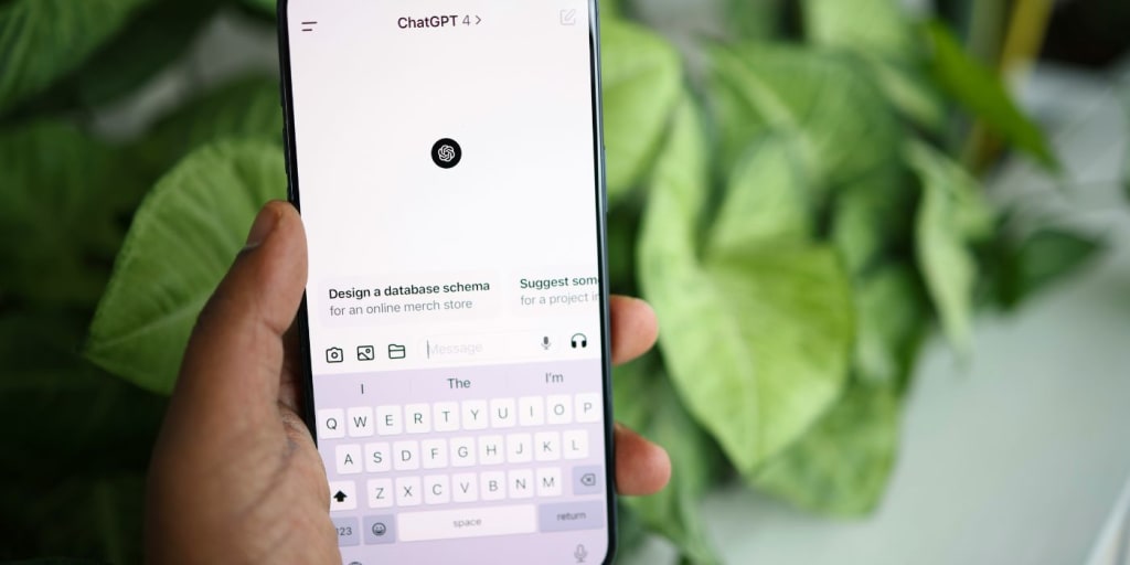 person holding phone with chatgpt on display