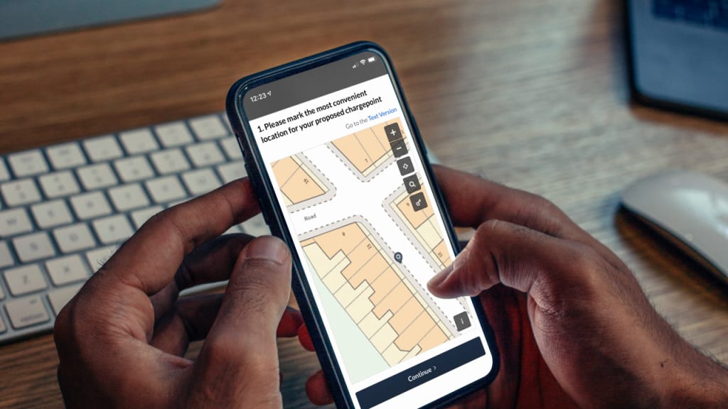 phone showing blocks on a geospatial map