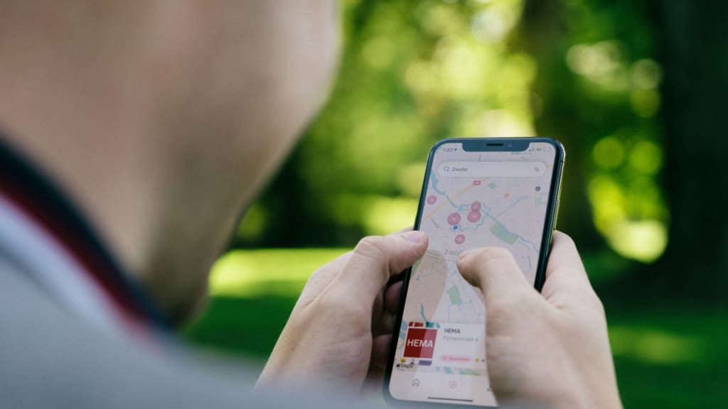 person looking at a geospatial map on their phone