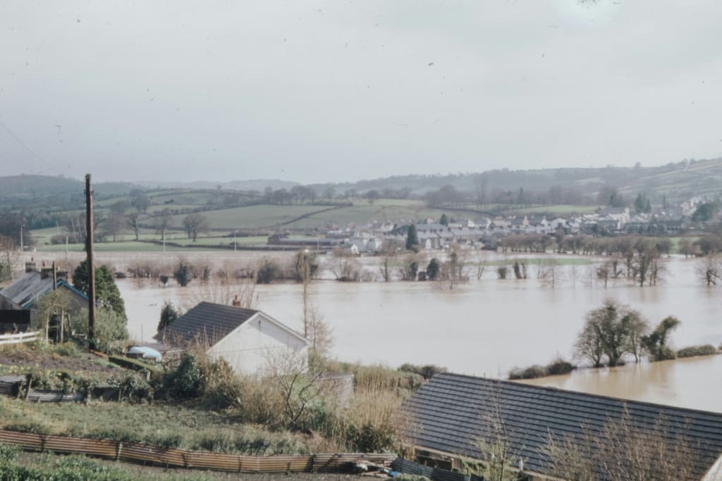 flooded area showing houses and fields