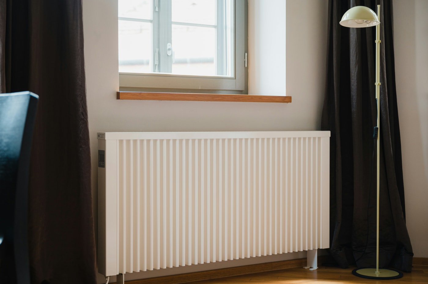 A radiator in a neutral, minimalist home.