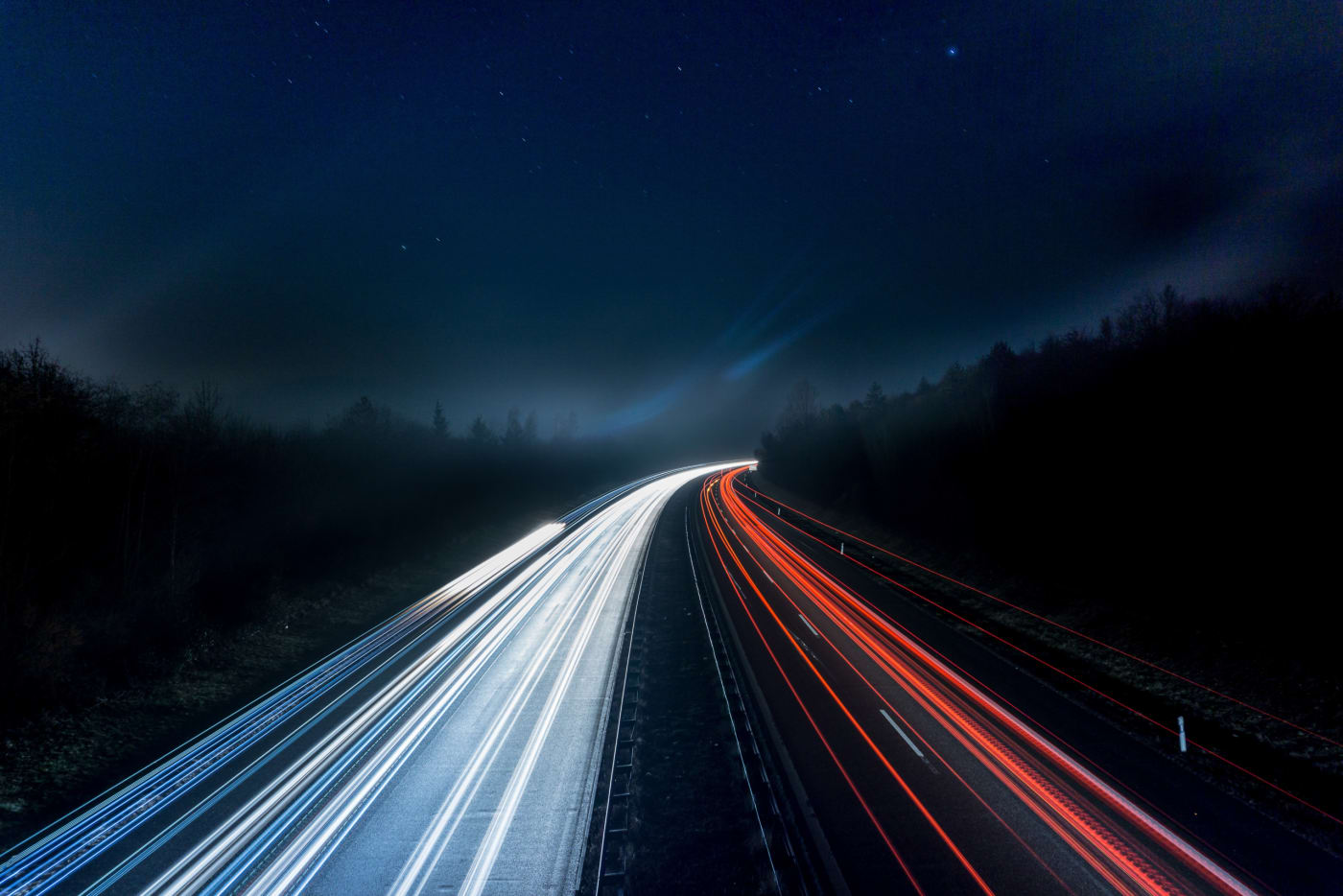 Long exposure shot of a motorway showing long blurs of car lights