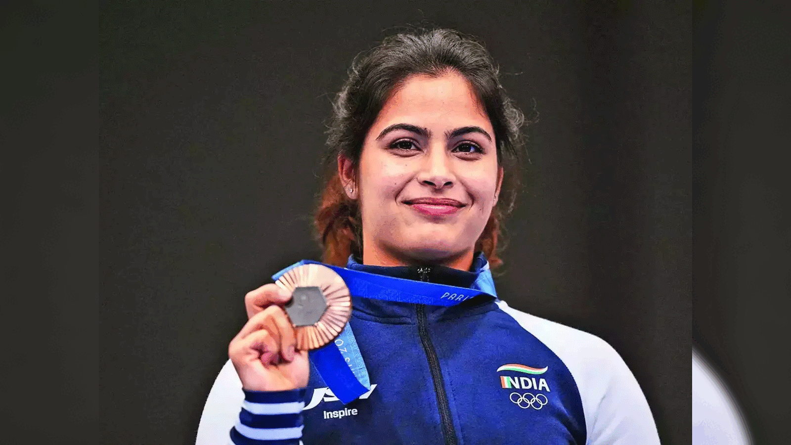 Athlete celebrating with bronze medal
