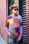 Original image of man in a multicolored sweater