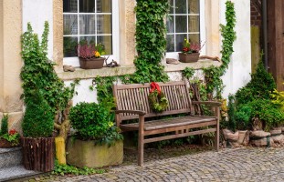 Original image of a bench outside a house