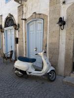 Original image of a moped in a street