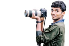 Isolated camera, straps and man