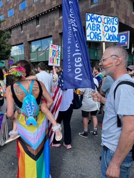 Members of Democrats Abroad Sweden marching in the Pride parade