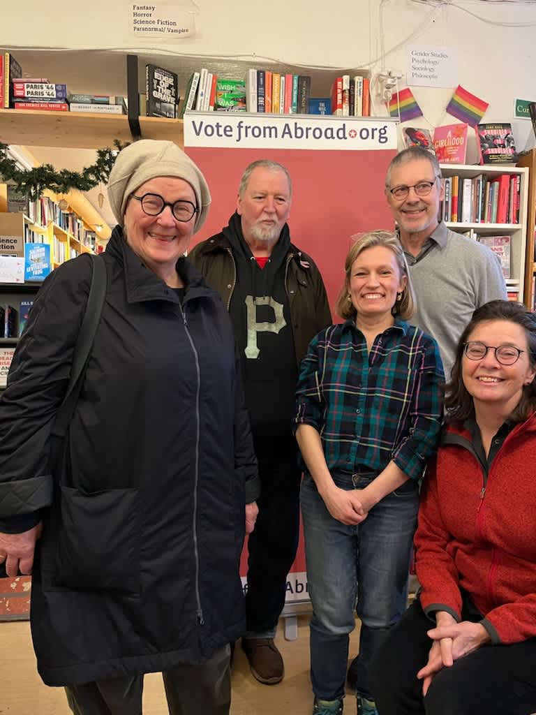 Democrats Abroad Sweden volunteers with curious passersby.